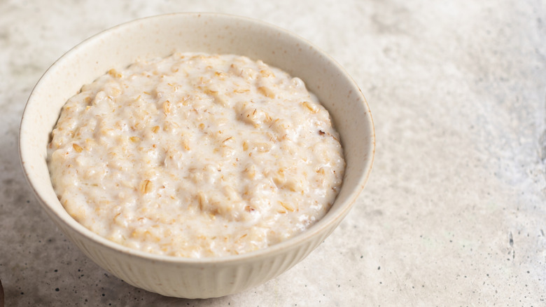 A bowl of oatmeal on a marble table