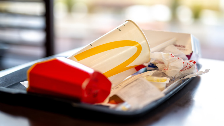 Trash from a McDonald's meal on a tray
