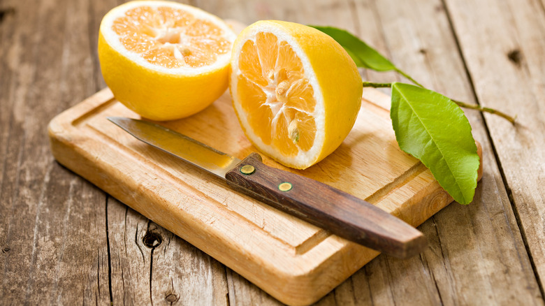 small cutting board with lemons