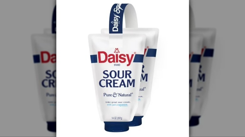 Two containers of Daisy Brand Pure and Nature Sour Cream