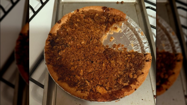 A Mock Apple Pie with a slice removed on a metal tray