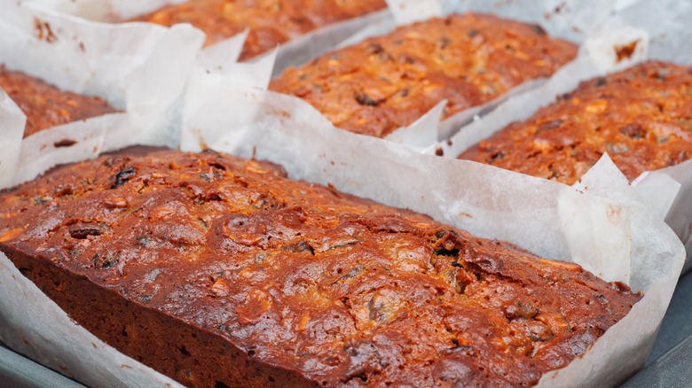 Loaves of fruitcakes in wax paper