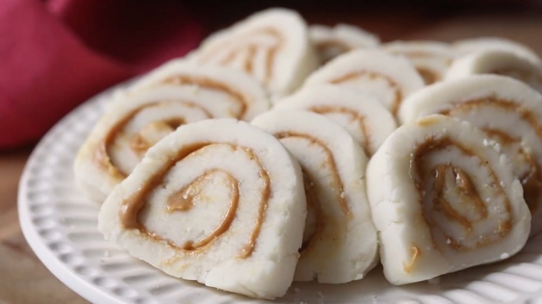 Potato candies with peanut butter swirl on a white plate