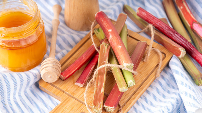 Sliced rhubarb pie on a white wooden table