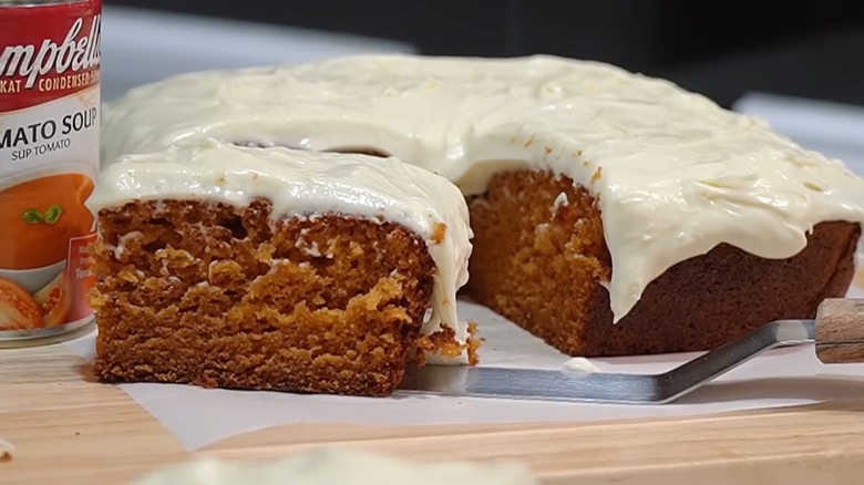 Tomato soup cake with frosting on wax paper