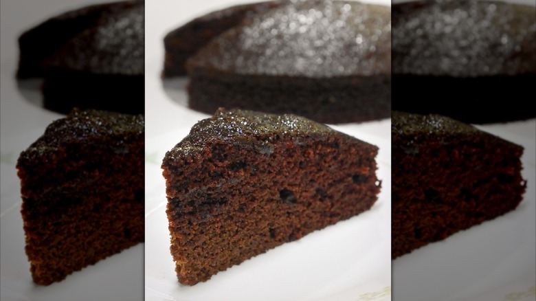 Slice of chocolate wacky cake on a white table