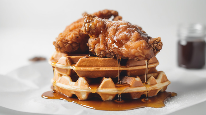 Chicken and waffles topped with syrup