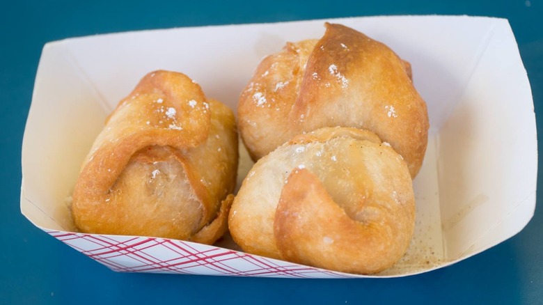 Balls of deep fried butter in a paper basket