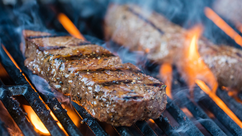 A close-up of a sirloin steak on a grill
