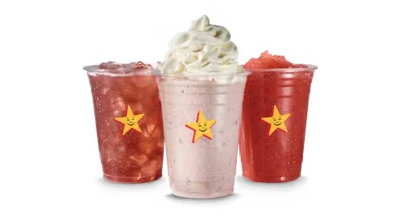 Three Carl's Jr cups filled with Triple Berry Tea, Triple Berry Shake, and Triple Berry Sparkler