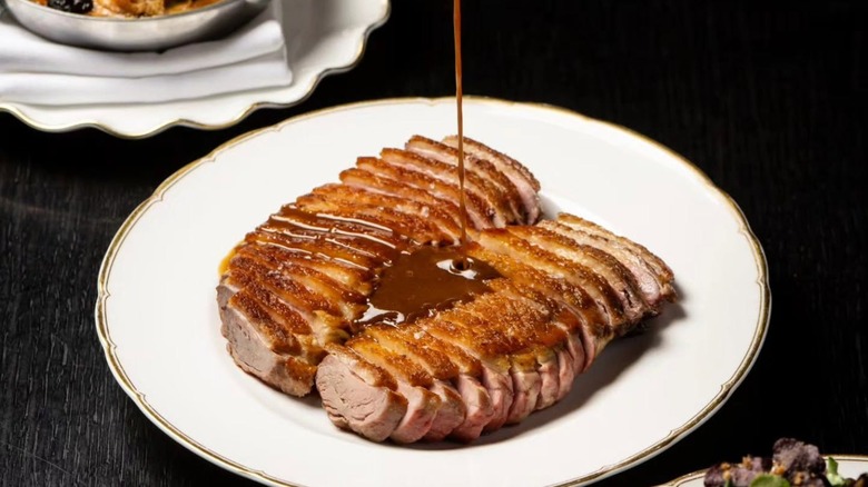Tableside Pressed Duck dish at Pasjoli Los Angeles