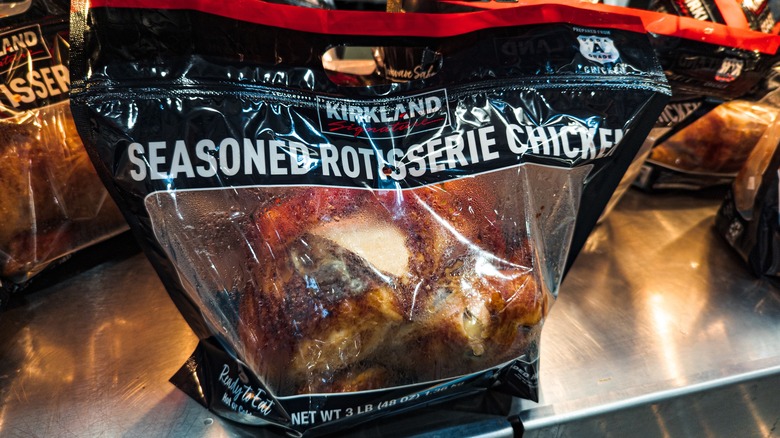A Costco Kirkland Signature Seasoned Rotisserie Chicken sits in its bag