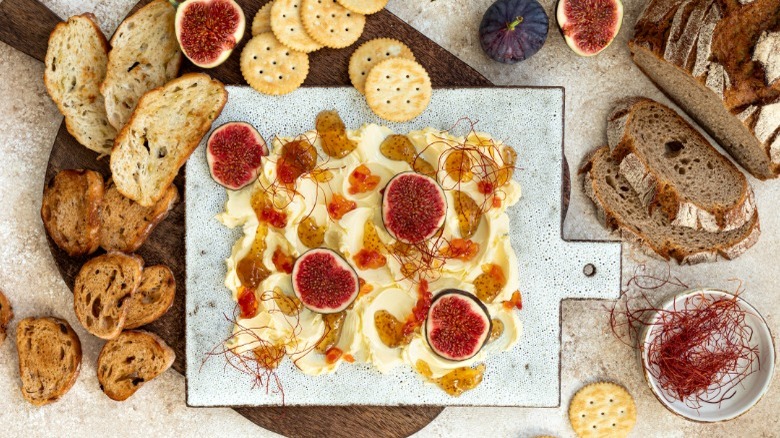 butter board with breads and toppings