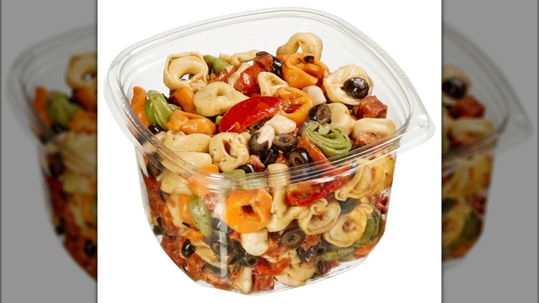 plastic tub of tortellini pasta salad