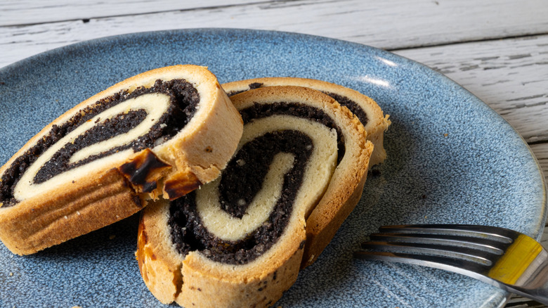 Overhead view of slices of poppyseed pastry on a plate