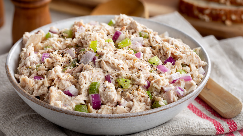 A bowl of tuna salad on a napkin