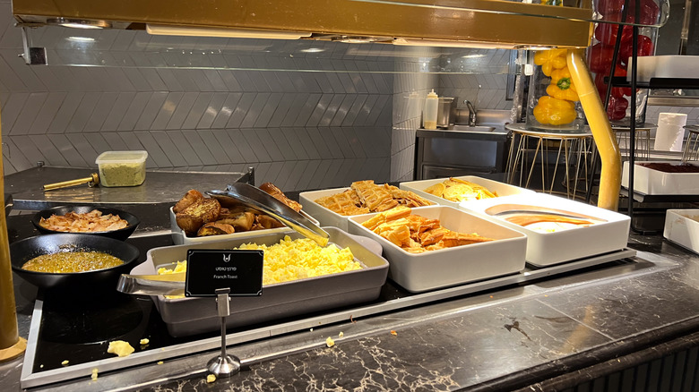 A buffet of breakfast foods, including eggs