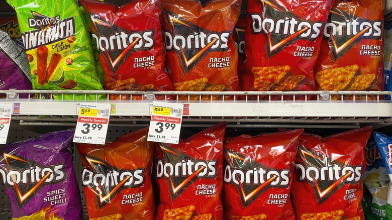 Rows of Doritos on a grocery store shelf.