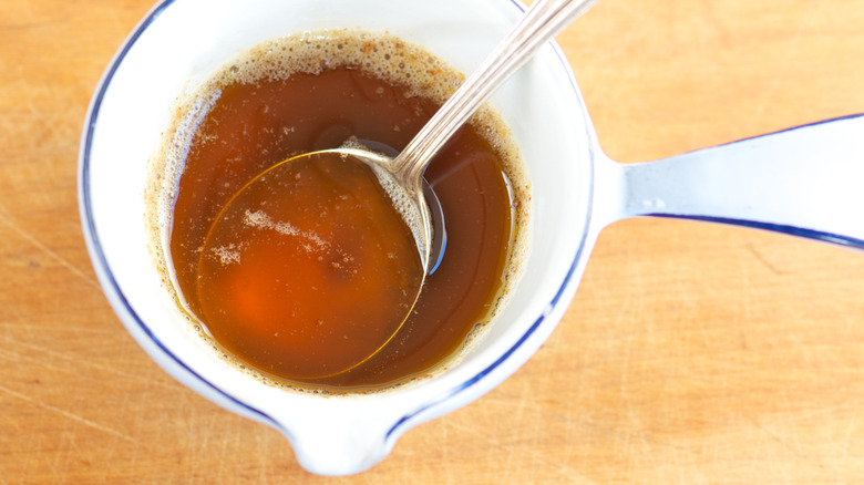 Browned butter in white dish with spoon