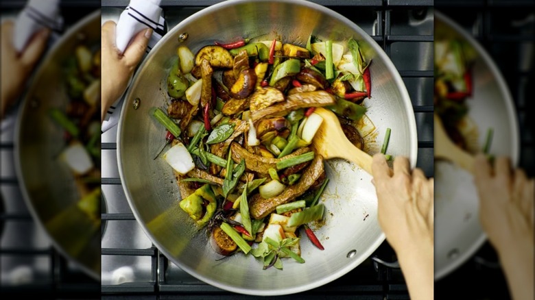 Stirfry being mixed in KitchenAid wok