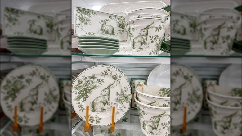 Green rabbit-themed dishware on display in HomeGoods