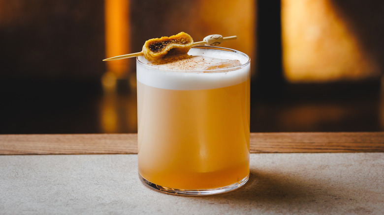 An Amaretto sour cocktail posed on tabletop