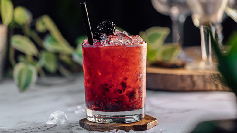 Close-up on a Bramble cocktail posed on countertop