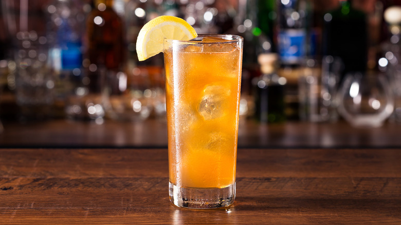 Glass of Long Island iced tea posed on bartop