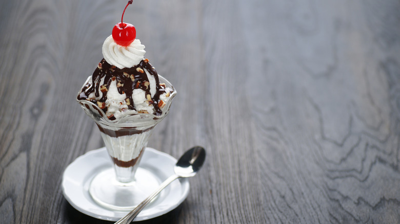 Hot fudge sundae in a glass tulip bowl