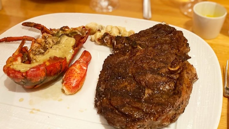 Steak and lobster, served at CUT