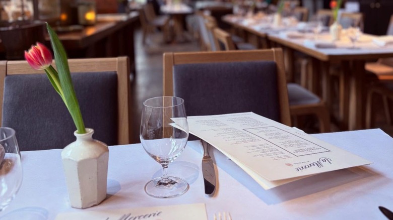The interior of La Mercerie, showing a table with menus