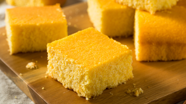 golden cornbread on wooden plater