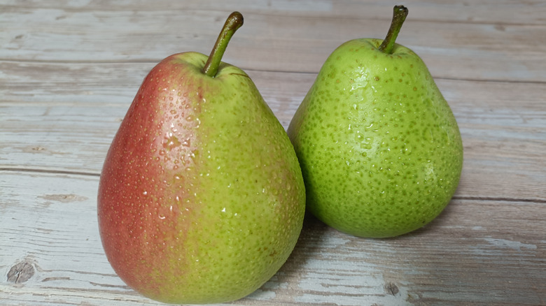 Two pears on a wooden table