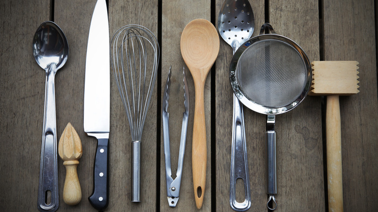Selection of metal and wooden kitchen tools