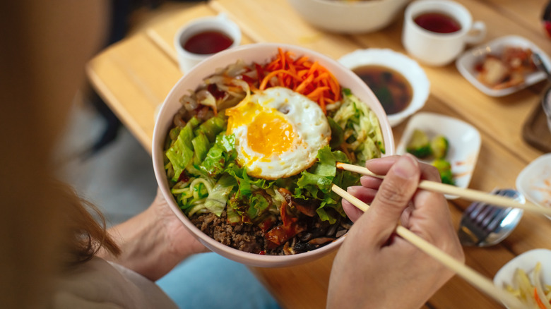 A person eats bibimbap