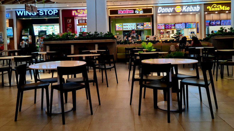 Tables and chairs in a mall food court