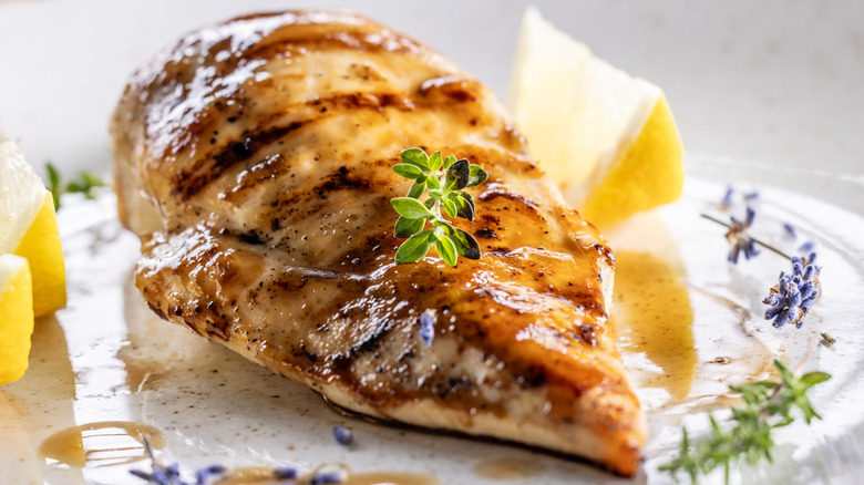 Grilled chicken breast on restaurant plate