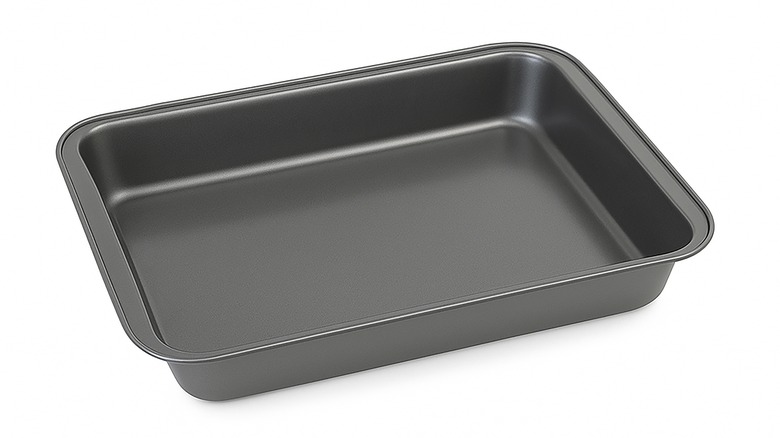 Close up of a metal baking pan isolated against a white background