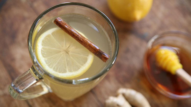 Overhead view of a hot toddy with lemon and cinnamon