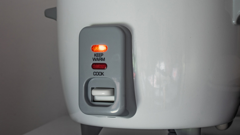 A rice cooker is set to its "keep warm" function