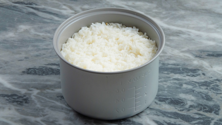 Cooked rice in a rice cooker pan