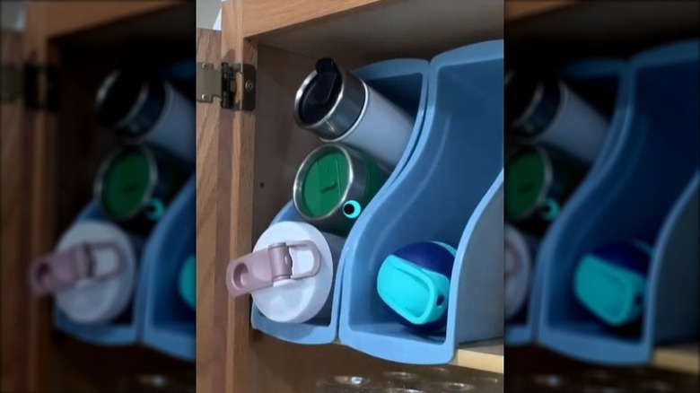 Blue Teaching Tree plastic book bin used to stow water bottles