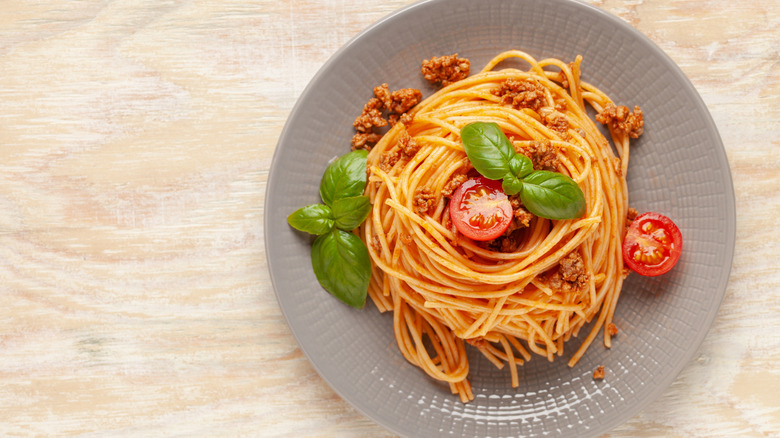 Top view of spaghetti on a wooden surface