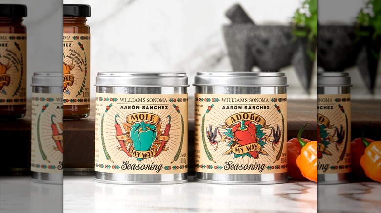 Squat metallic jars of Aarón Sánchez's "Mole My Way" and "Adobo My Way" seasonings