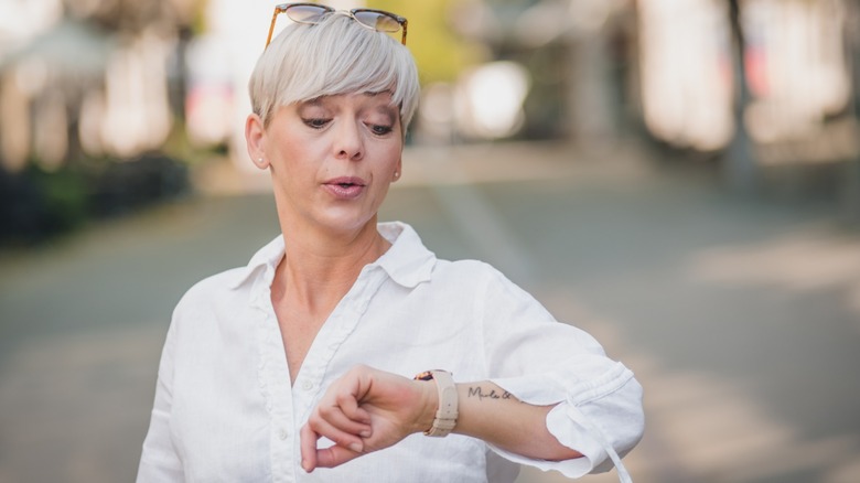 A woman checking her watch