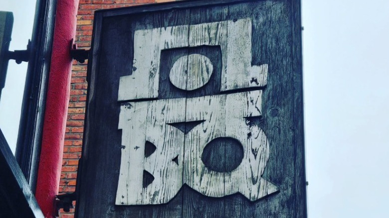 Exterior signage for Hole in the Wall BBQ