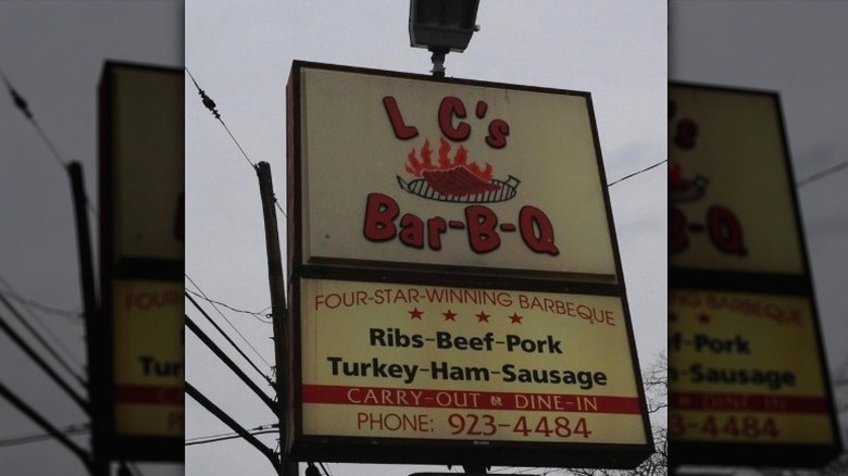 A close up of the exterior sign at LC's Bar-B-Q