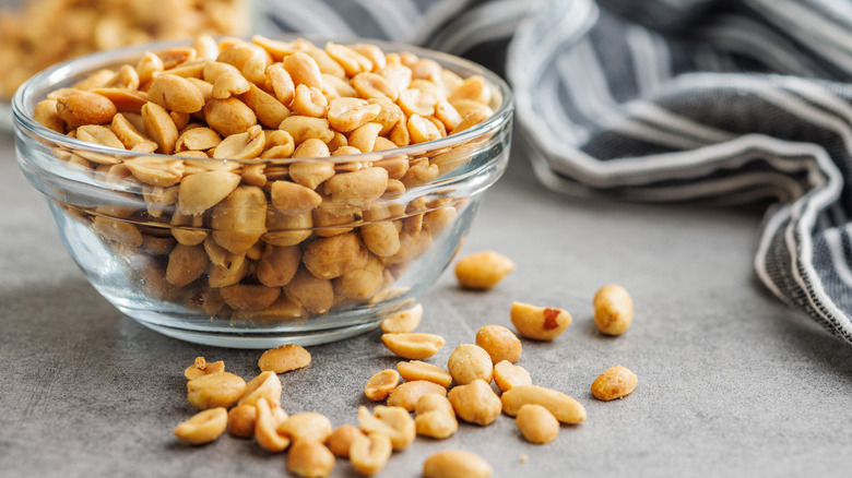 Roasted peanuts in a glass bowl