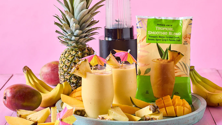 Promo shot of Trader Joe's Tropical Smoothie Blend frozen fruit mix against pink background