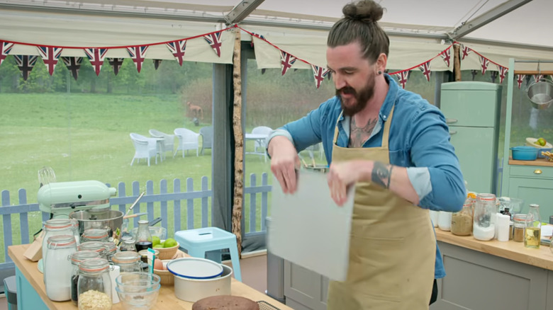 Contestant Dan Chambers fans his cake on Great British Bake Off